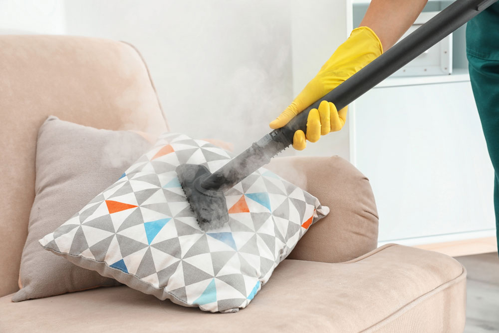 Pillow being steamed by professional